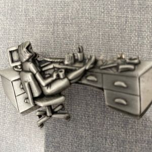 JJ secretary pin. Pewter color. VG used condition. Measures approx 2 1/2 ".
